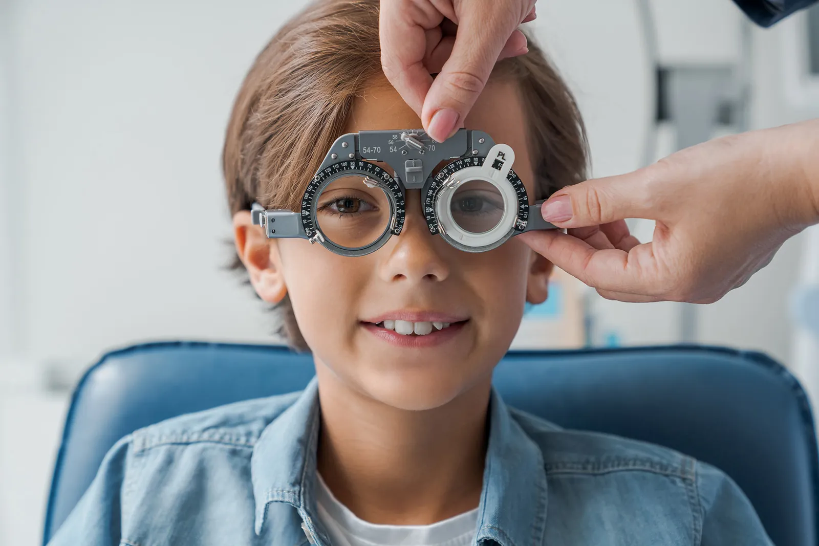 Young boy with a phoropter during sight testing
